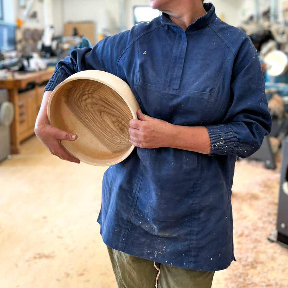 Woman in woodturning smock
