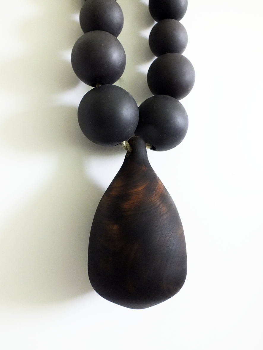 Black pearl wall necklace by Merging Matter